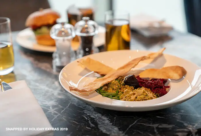 Guest relaxing in a Birmingham Airport lounge