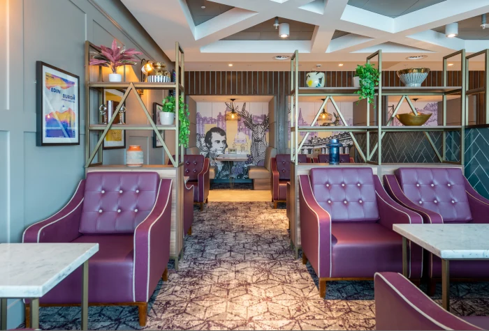 Booth seating inside Aspire Lounge at Edinburgh Airport
