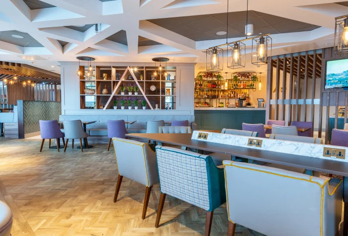 Dining and seating area inside Aspire Lounge at Edinburgh Airport