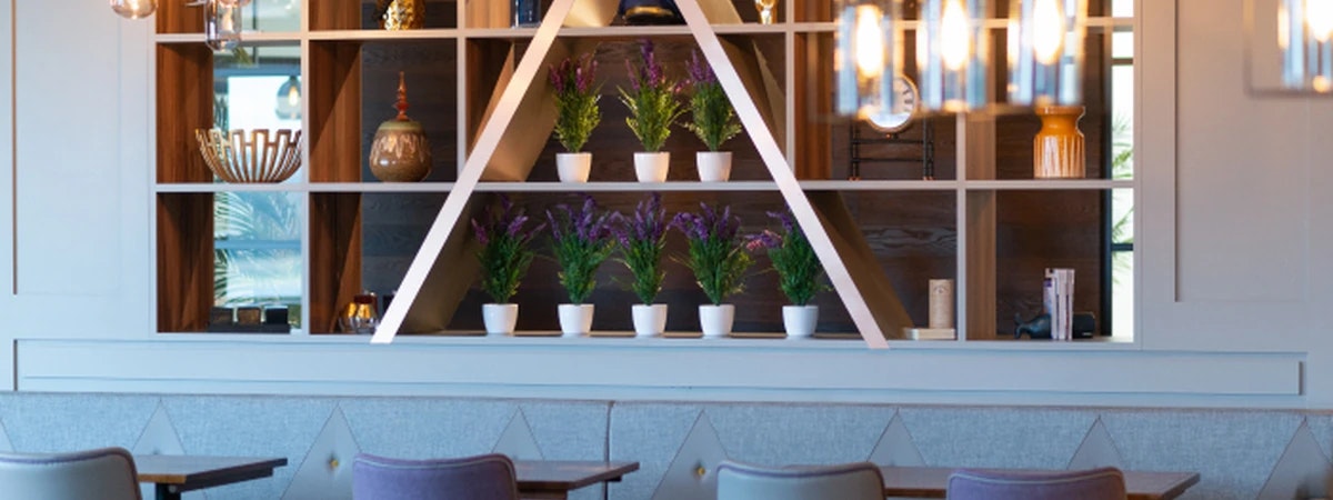 Interior seating and lighting inside Aspire Lounge at Edinburgh Airport