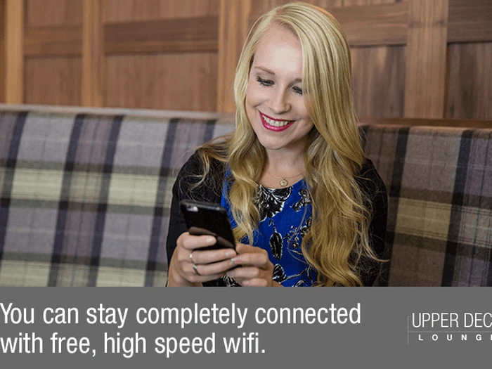 Wide seating area inside the Upper Deck Lounge at Glasgow Airport