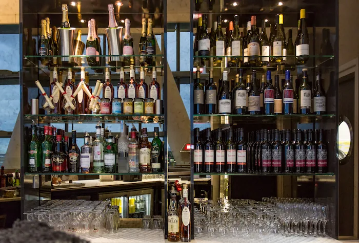Bar area with wine and spirits in the Aspire Lounge at Heathrow Terminal 5