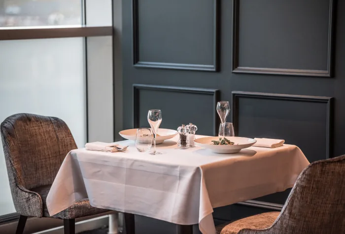 Dining table set for guests in Clubrooms at Heathrow Terminal 3
