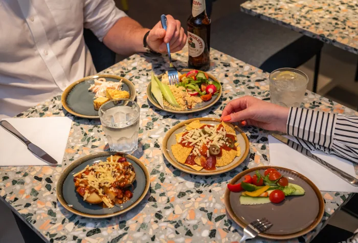 Selection of hot and cold food plates in a Heathrow airport lounge