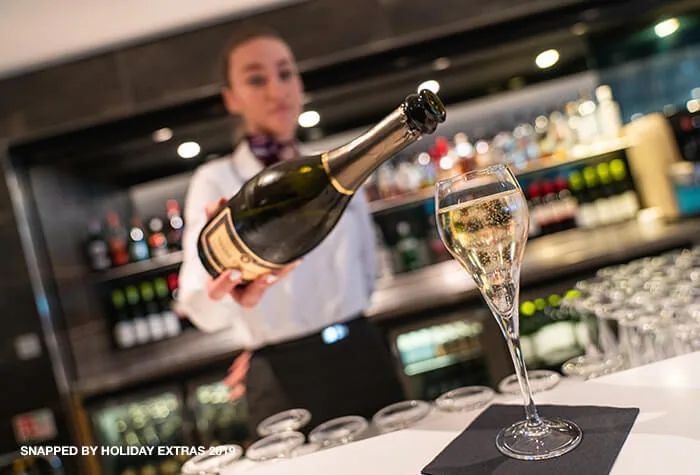 Champagne being poured at No1 Lounge, Heathrow Terminal 3