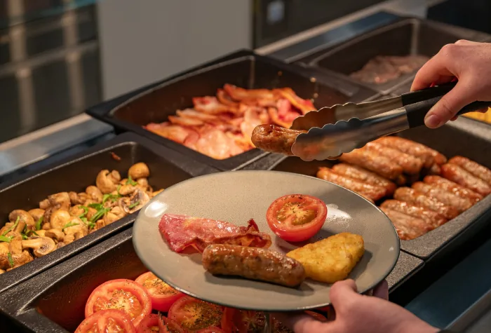 Hot breakfast being served in the 681 lounge at Leeds Bradford Airport