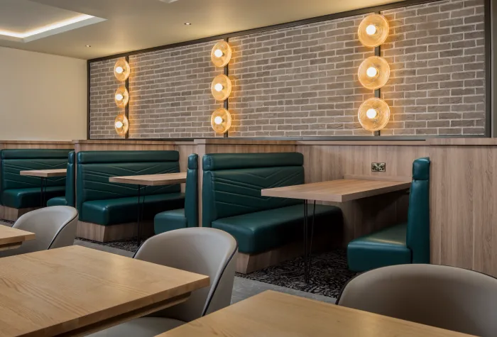 Booth-style seating area in the Aspire Lounge at Liverpool Airport