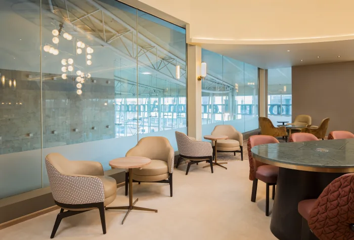 Comfortable lounge seating by the window at Aspire Luxe in Liverpool Airport