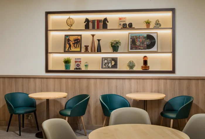 Seating area with display shelves inside the Aspire Lounge at Liverpool Airport