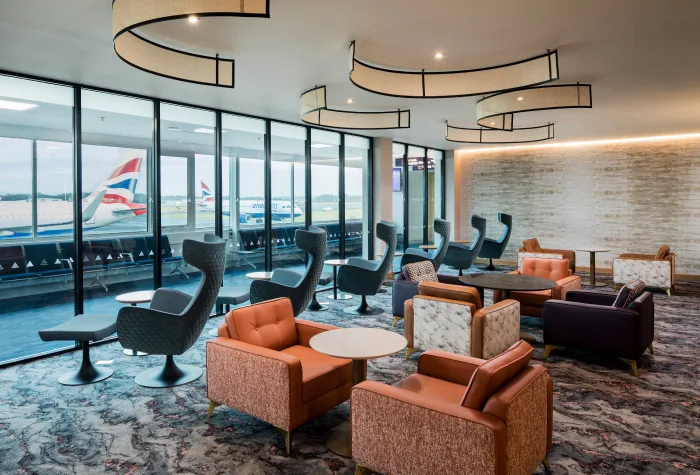 Interior seating area inside the Suite by Aspire lounge at Newcastle Airport
