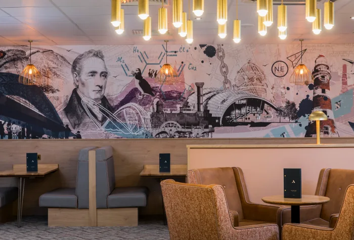 Booth seating area inside the Aspire Lounge at Newcastle Airport