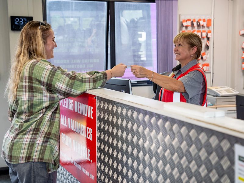 Customer checking in at Gatwick parking reception