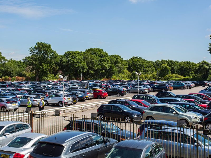 Rows of cars parked in a secure Gatwick parking compound