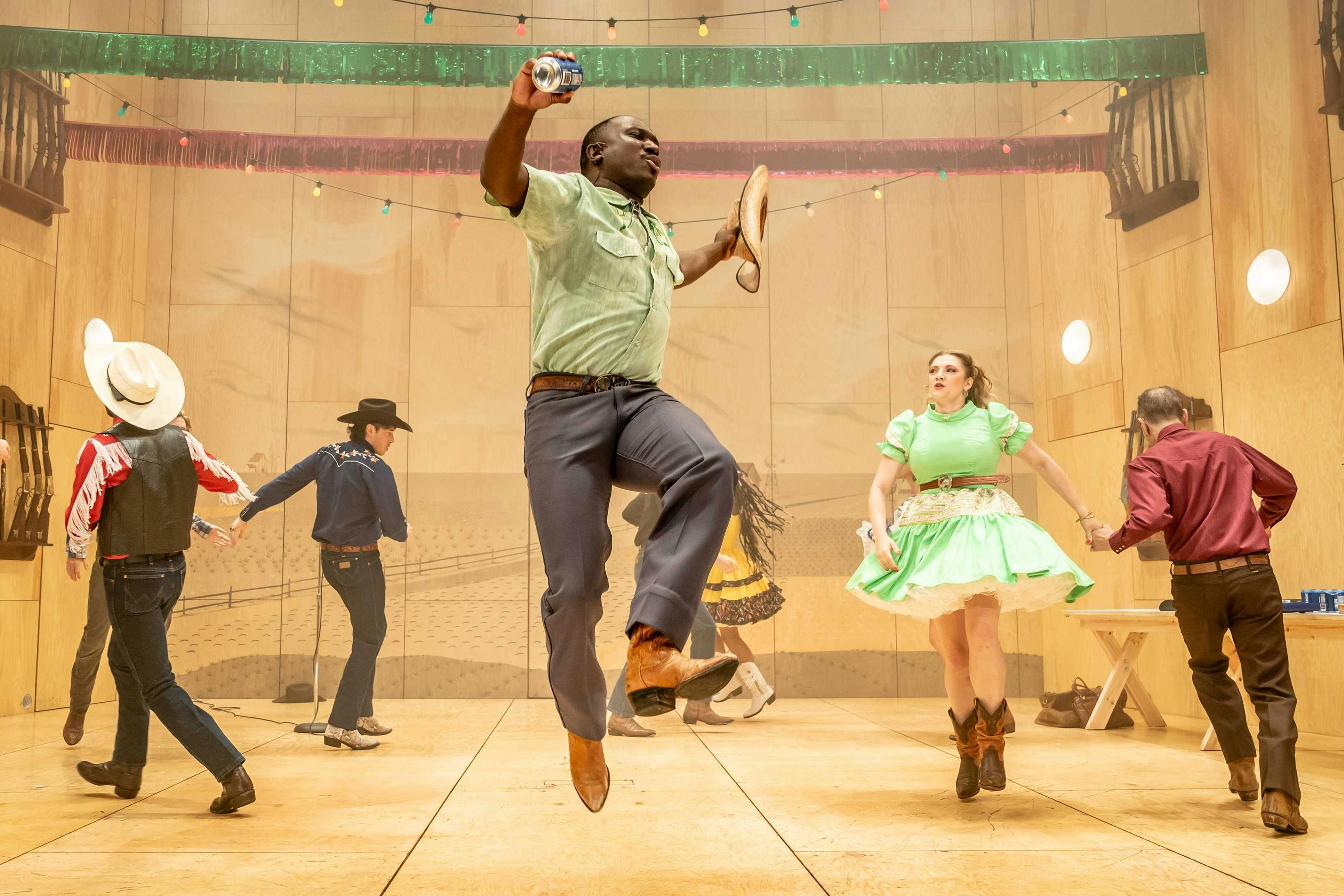 Oklahoma: The Musical - group of people dancing on stage