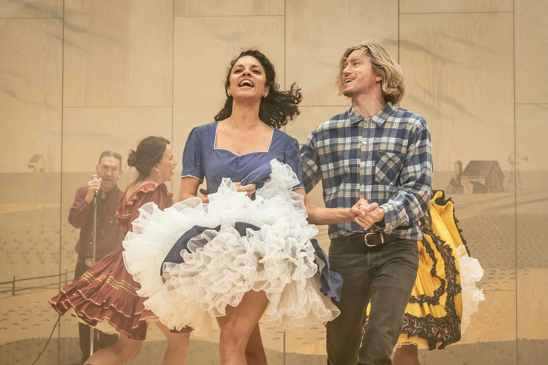 Oklahoma: The Musical - man and woman dancing together on stage