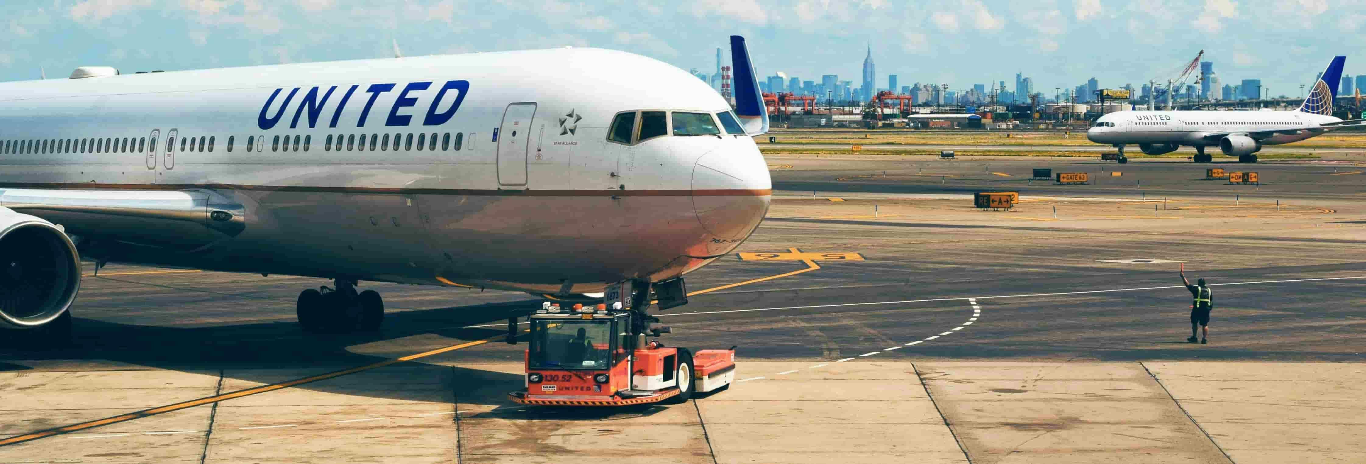 Image of a quiet airport terminal with a plane in the background