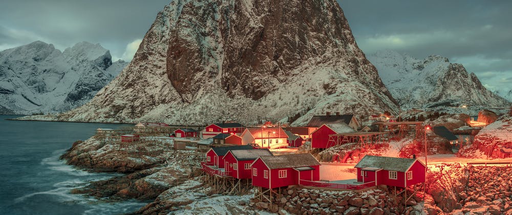 Red huts looking out on a fjord in Norway