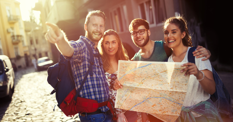 A group of people looking at a map