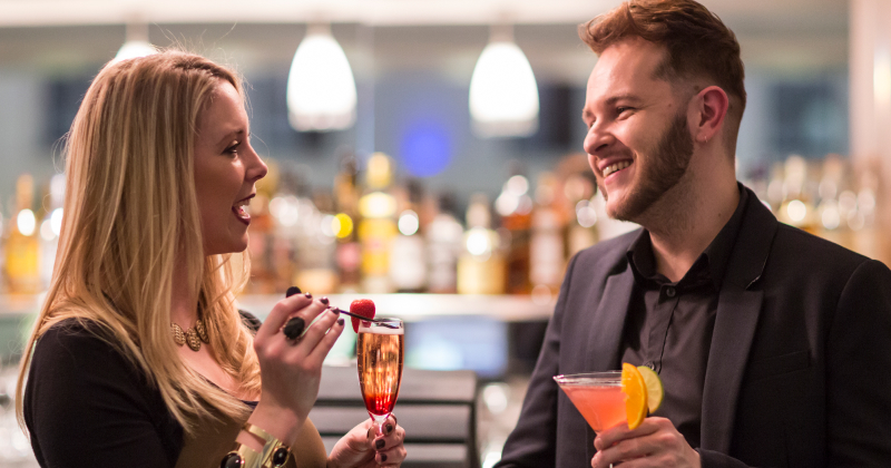 Couple drinking cocktails at the Sofitel hotel, Gatwick Airport