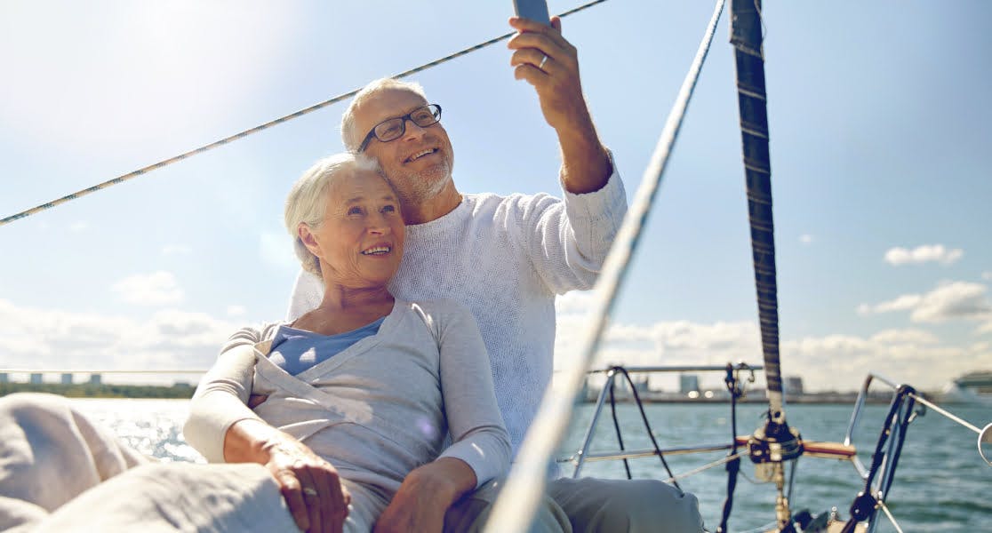 Couple on a yacht taking a selfie