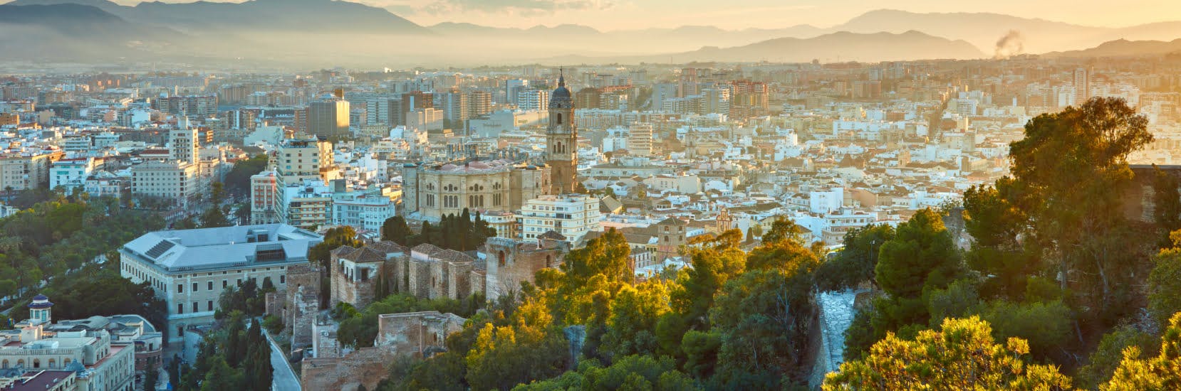 Scenic European city skyline at sunset, illustrating travel insurance for Europe.