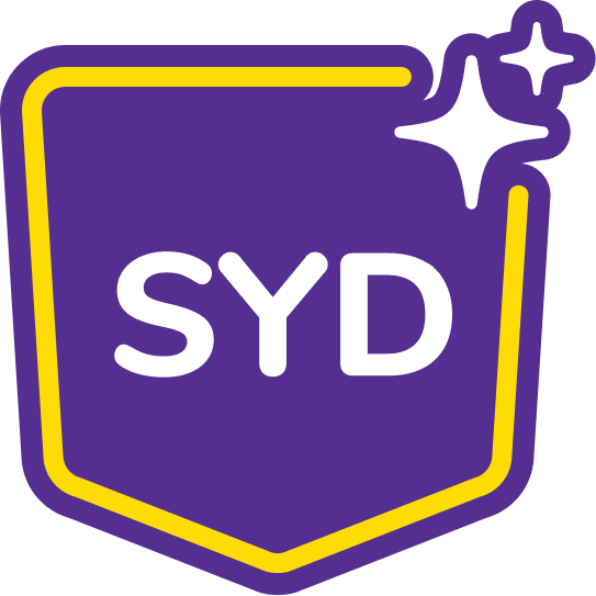 SYD logo - a purple badge with a yellow border, the word SYD in bold white letters, and two sparkles in the top right corner.