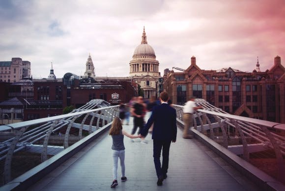 Family walking across London Bridge
