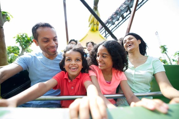 Excited family on a rollercoaster ride