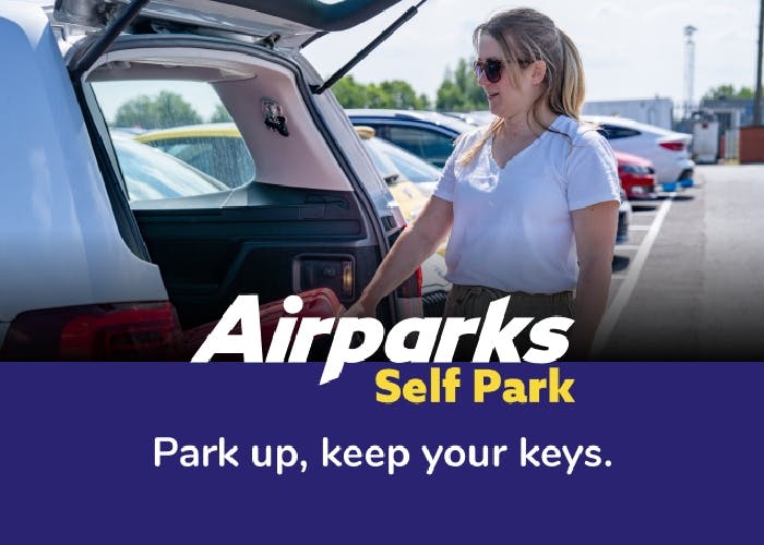 Smiling traveller parking at Birmingham Airport Self Park car park